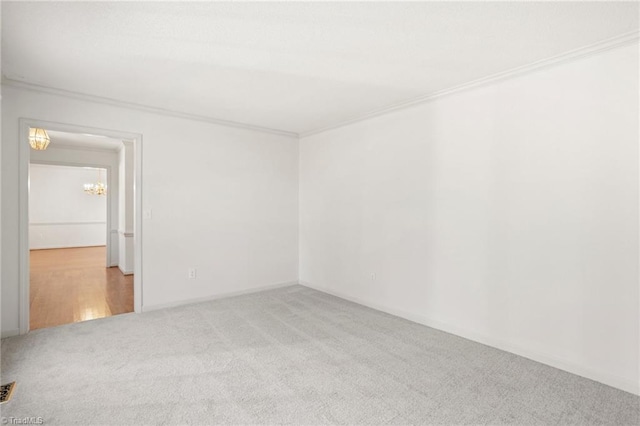 unfurnished room with carpet floors and ornamental molding