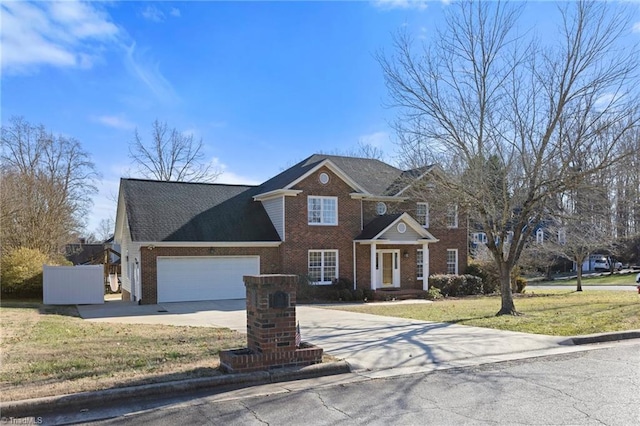 view of front of home with a front yard and a garage