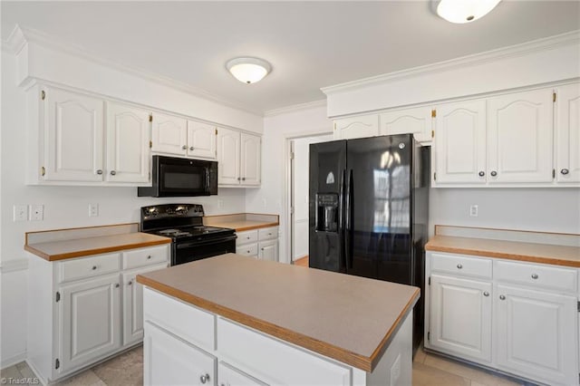 kitchen with crown molding, white cabinetry, a center island, and black appliances