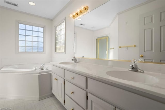 bathroom featuring vanity, crown molding, and a tub