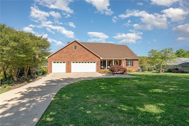 view of front of house with brick siding, driveway, a front yard, and a garage