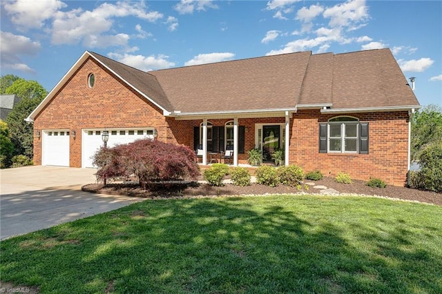 view of front facade featuring covered porch, brick siding, concrete driveway, a front yard, and an attached garage