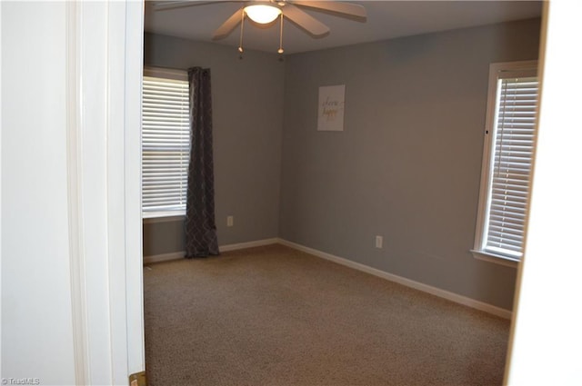 empty room with carpet floors and ceiling fan