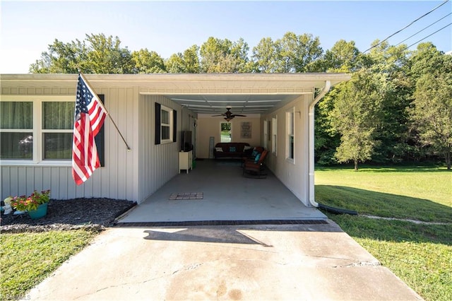 exterior space featuring a yard, a carport, and ceiling fan