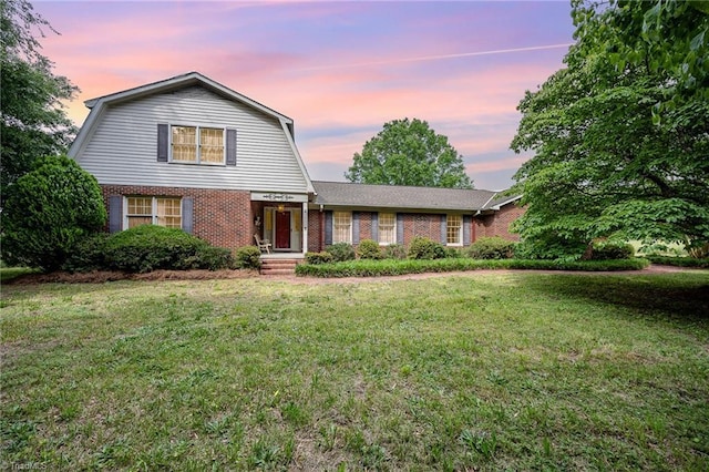 4630 Woodleaf Rd, Salisbury, NC 28147 - colonial inspired home featuring a gambrel roof, brick siding, and a lawn