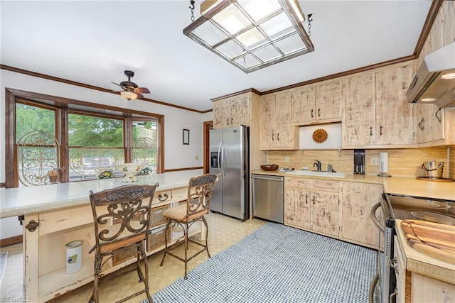 4630 Woodleaf Rd, Salisbury, NC 28147 - kitchen with stainless steel appliances, light countertops, crown molding, under cabinet range hood, and light brown cabinetry