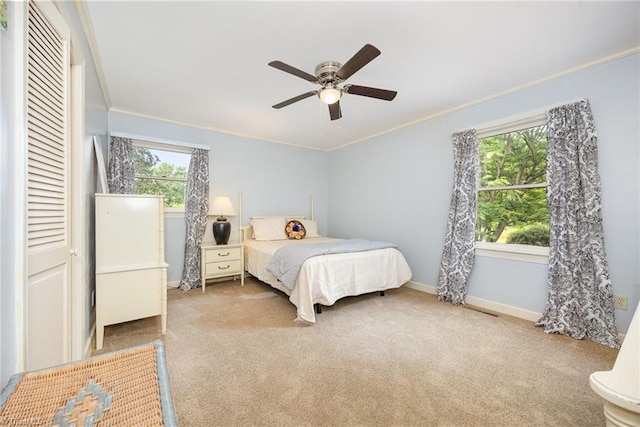 4630 Woodleaf Rd, Salisbury, NC 28147 - carpeted bedroom with crown molding, a ceiling fan, and a closet