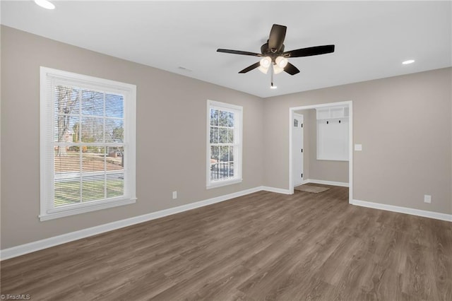 spare room with wood-type flooring and ceiling fan