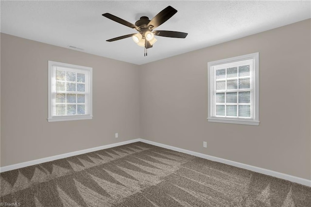 unfurnished room featuring carpet and ceiling fan