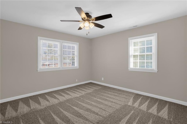 carpeted empty room featuring ceiling fan