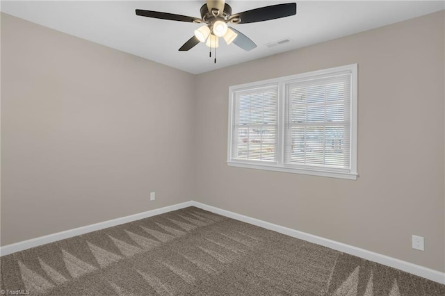 spare room featuring carpet flooring and ceiling fan