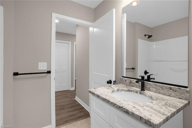 bathroom with vanity and walk in shower