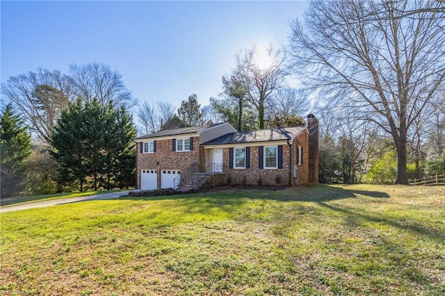 view of front of home featuring a garage and a front lawn