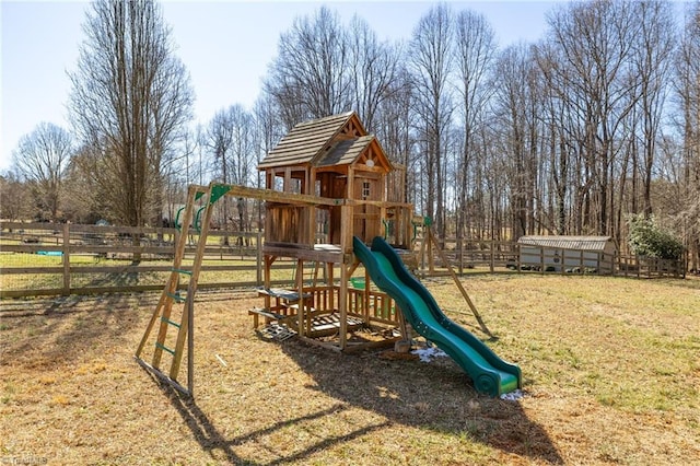 communal playground with a yard and fence