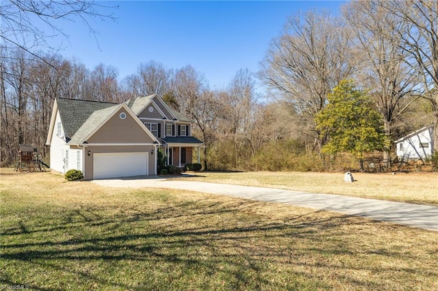 traditional home with a garage, a front lawn, and concrete driveway