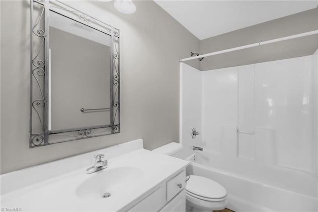 full bath featuring vanity, shower / tub combination, and toilet