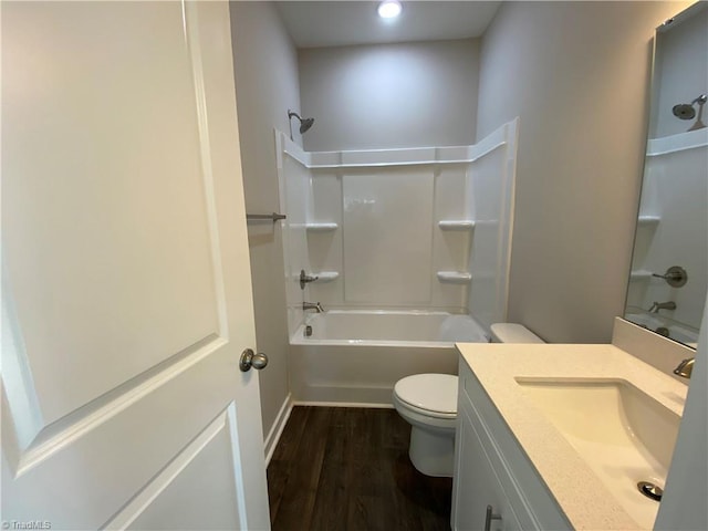 full bathroom with vanity, bathing tub / shower combination, toilet, and wood finished floors