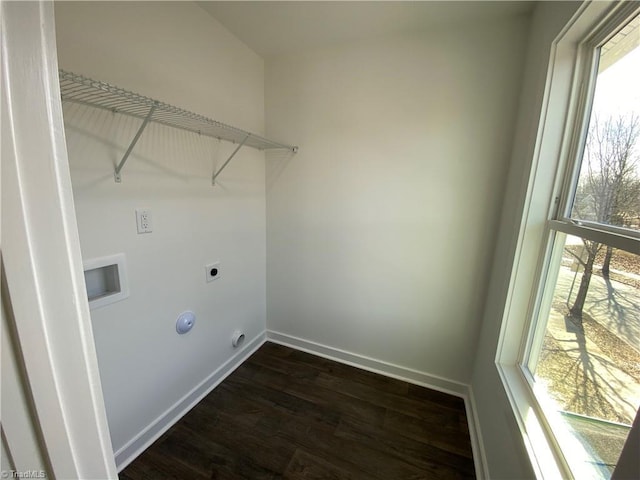 clothes washing area with laundry area, baseboards, dark wood-style flooring, hookup for a washing machine, and hookup for an electric dryer