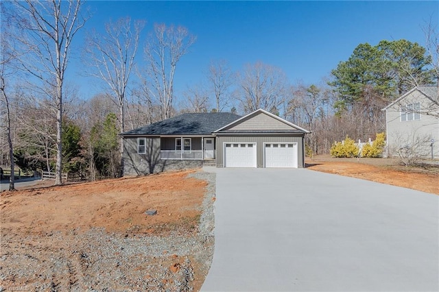 view of front of house featuring a garage, driveway, and board and batten siding