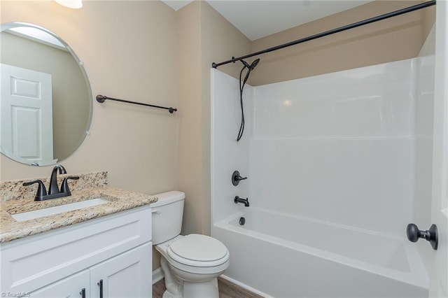 bathroom featuring vanity, toilet, and shower / bathtub combination