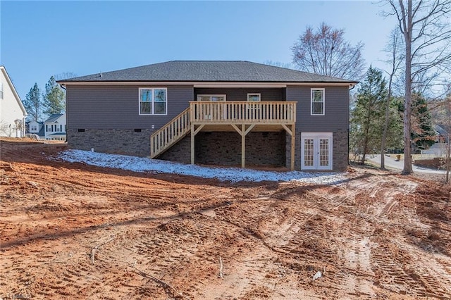 rear view of property with french doors, a deck, and stairs