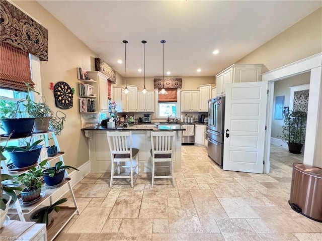 311 Cherry St, Mount Airy, NC 27030 - kitchen with stainless steel appliances, a peninsula, stone tile flooring, dark countertops, and open shelves