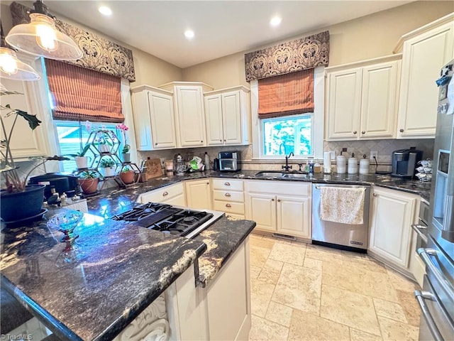 311 Cherry St, Mount Airy, NC 27030 - kitchen with dishwasher, a sink, decorative backsplash, recessed lighting, and stone tile floors