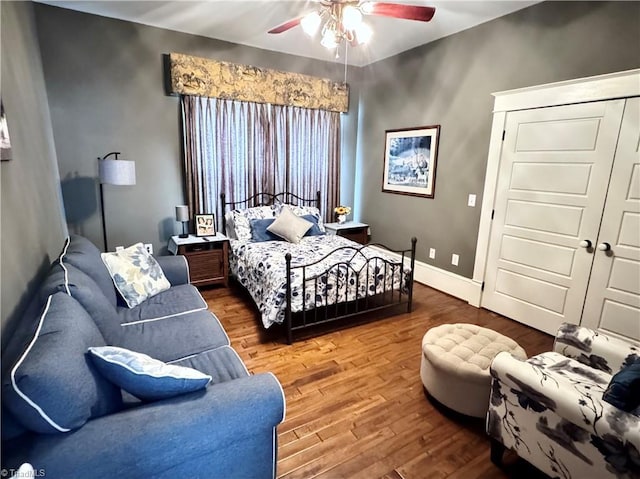 311 Cherry St, Mount Airy, NC 27030 - bedroom with wood finished floors, baseboards, a ceiling fan, and a closet