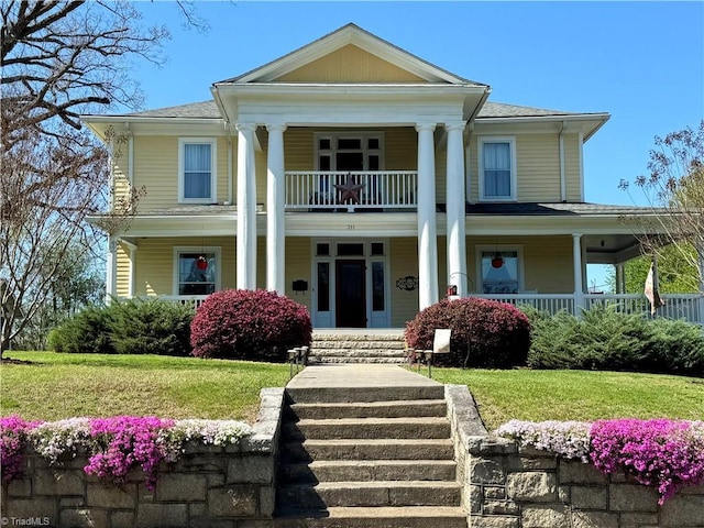 311 Cherry St, Mount Airy, NC 27030 - neoclassical / greek revival house with a porch, a balcony, a front lawn, and roof with shingles