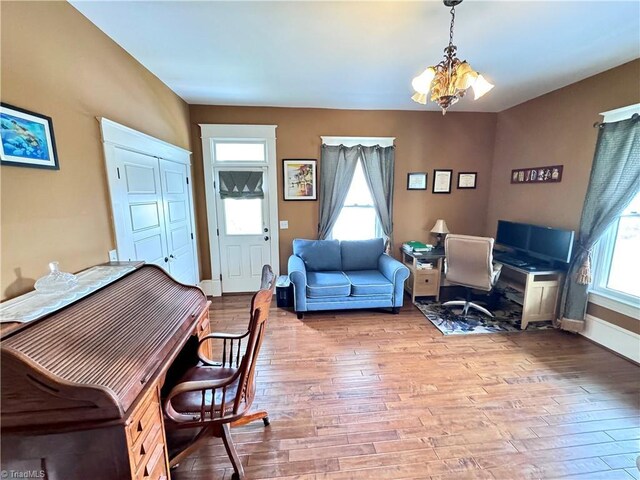 311 Cherry St, Mount Airy, NC 27030 - office featuring wood finished floors, a chandelier, and baseboards