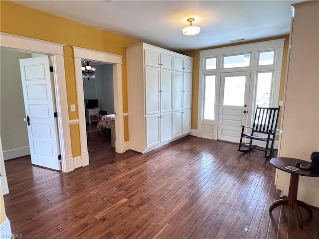 311 Cherry St, Mount Airy, NC 27030 - entryway featuring dark wood finished floors, baseboards, and a chandelier