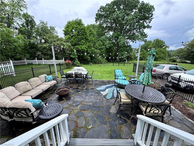 311 Cherry St, Mount Airy, NC 27030 - view of patio with outdoor dining space, an outdoor living space with a fire pit, and view of wooded area