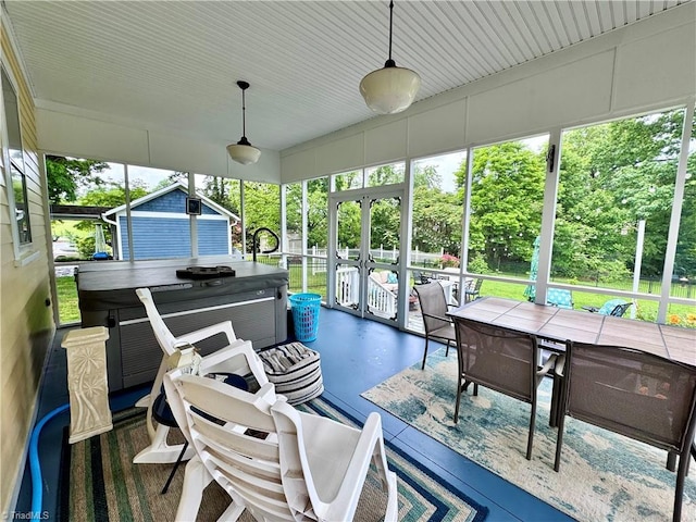 311 Cherry St, Mount Airy, NC 27030 - sunroom with a jacuzzi, healthy amount of natural light, outdoor dining space, and french doors