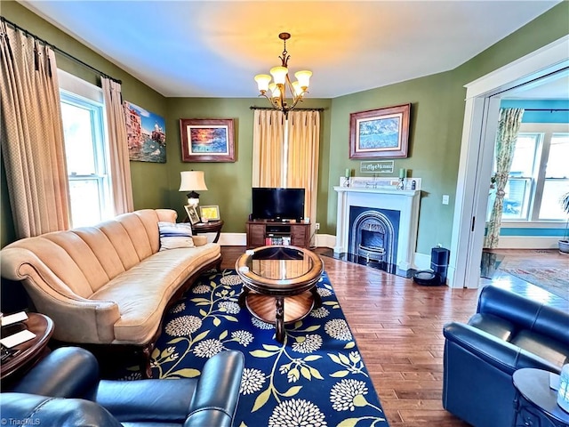 311 Cherry St, Mount Airy, NC 27030 - living area featuring a chandelier, wood finished floors, healthy amount of natural light, and baseboards
