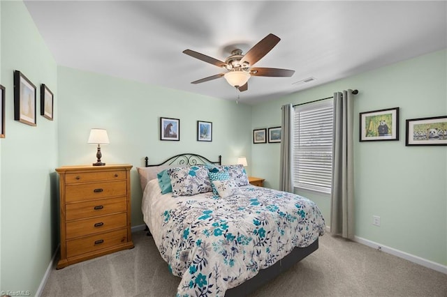bedroom featuring carpet flooring, baseboards, and ceiling fan