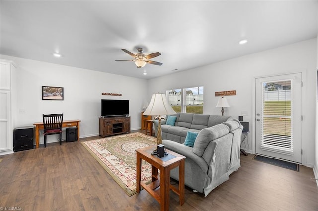 living room featuring ceiling fan, dark wood-type flooring, and recessed lighting