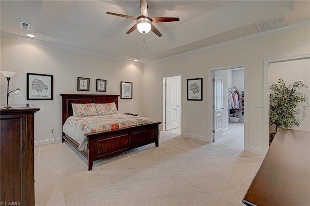 4240 Prestwick Xing, Winston-Salem, NC 27106 - bedroom with a raised ceiling, light colored carpet, ornamental molding, a walk in closet, and baseboards