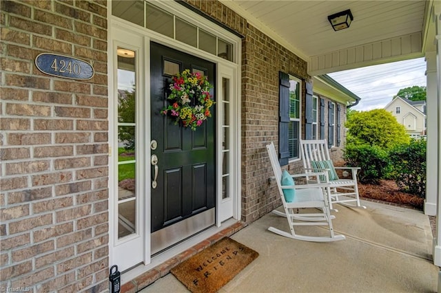 4240 Prestwick Xing, Winston-Salem, NC 27106 - property entrance with covered porch and brick siding