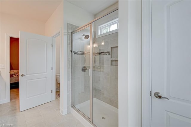 4240 Prestwick Xing, Winston-Salem, NC 27106 - bathroom featuring a stall shower, toilet, connected bathroom, tile patterned flooring, and baseboards