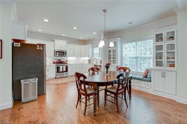 4240 Prestwick Xing, Winston-Salem, NC 27106 - dining area featuring light wood-style floors, ornamental molding, and recessed lighting