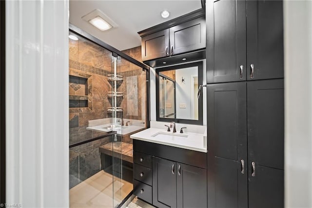 full bath with a stall shower and vanity