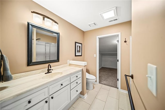 full bathroom featuring tile patterned floors, visible vents, toilet, and vanity