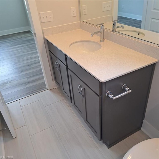 bathroom featuring toilet and vanity