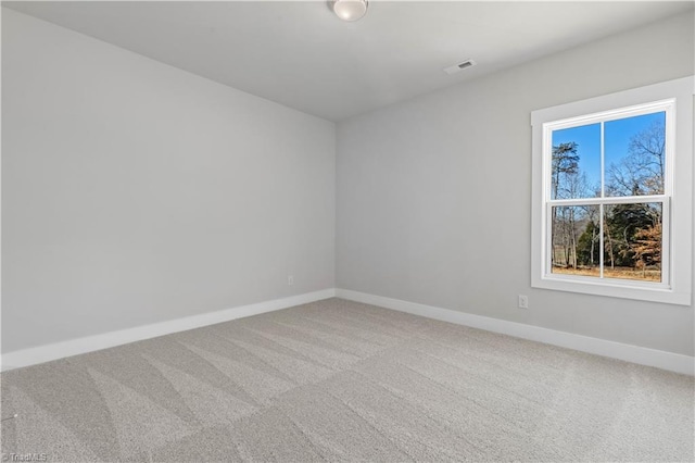 unfurnished room with carpet flooring