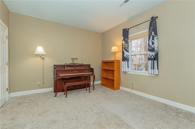 miscellaneous room featuring light colored carpet