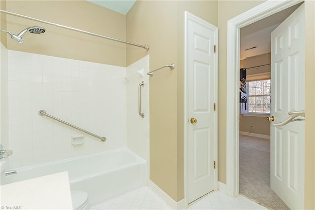 bathroom with shower / bathing tub combination and toilet