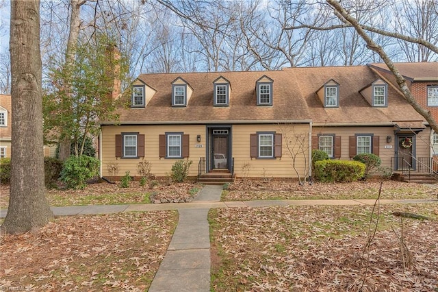 view of new england style home