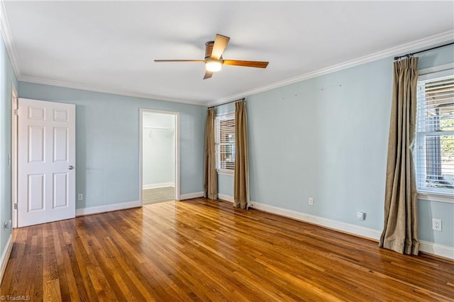 unfurnished bedroom with hardwood / wood-style floors, ornamental molding, and ceiling fan