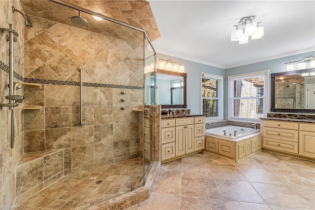 bathroom featuring vanity, ornamental molding, and separate shower and tub