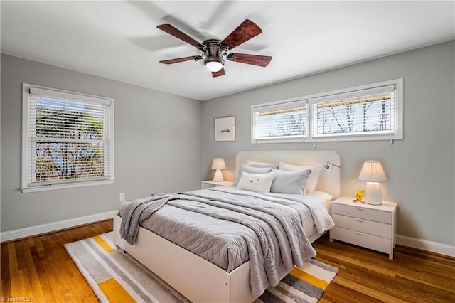 bedroom featuring dark hardwood / wood-style flooring and ceiling fan